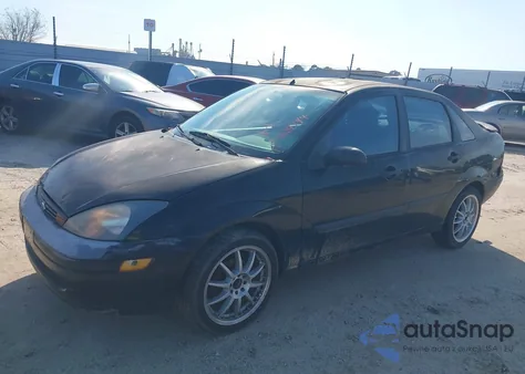 2004 Ford Focus Lx z USA, uszkodzony, nr VIN 1FAFP33Z94W194683